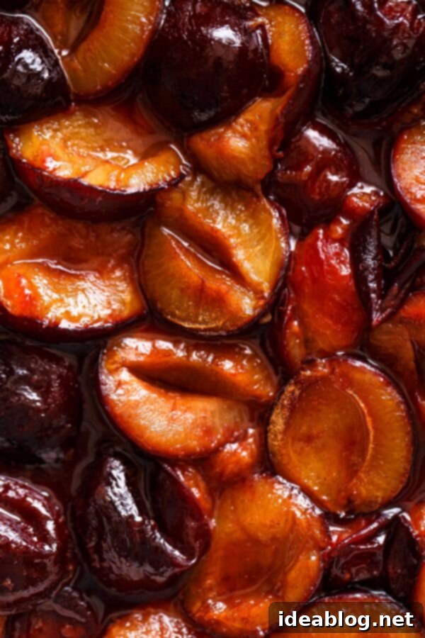 Slow-Roasted Plum Compote 5 Close up view of roasted plum compote, showcasing its rich, syrupy texture