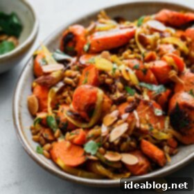 Roasted Golden Carrots with Savory Farro 12 Golden Carrots and Farro Salad on Platter with Fresh Herbs and Toasted Almonds