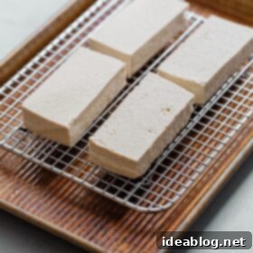 Secrets to Perfectly Pressed Tofu 11 Tofu Being Pressed