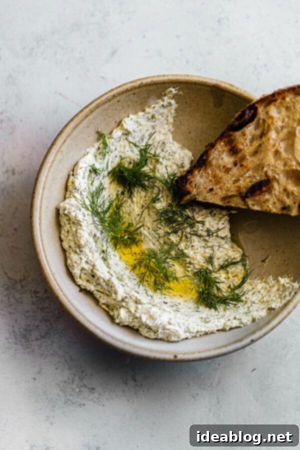 Whipped Garlic Herb Goat Cheese 3 Garlic Dill Goat Cheese Spread in Bowl with Grilled Bread slices