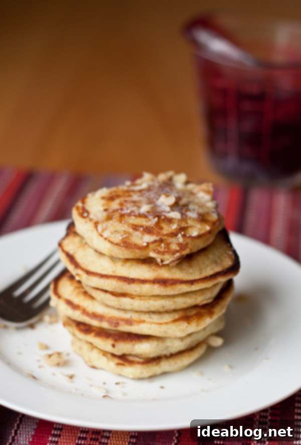 Golden Minis with Blackberry Bliss 5 Fresh blackberries and a bowl of homemade blackberry syrup next to a stack of pancakes