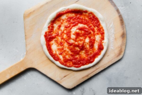Perfect Homemade Pizza Sauce 13 Homemade Pizza Sauce Spread on Pizza Dough on a Pizza Peel