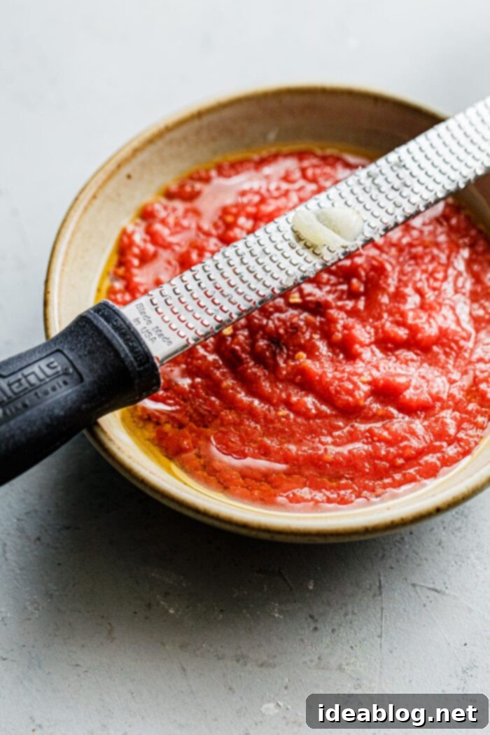 Perfect Homemade Pizza Sauce 6 Microplaning Garlic into Pizza Sauce