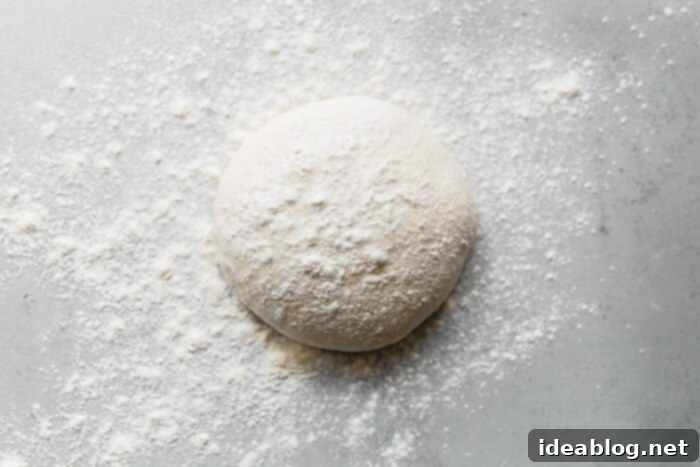 Artisan Sourdough Pizza Dough 21 Sourdough Pizza Dough Ball Dusted with Flour, ready for shaping