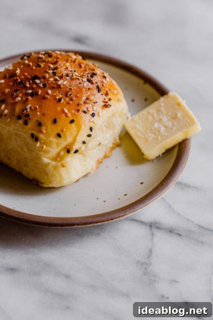 Ultimate Everything Dinner Rolls 20 Everything Dinner Rolls served with butter, ready to be enjoyed.