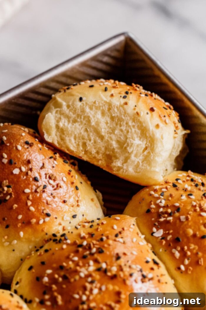 Ultimate Everything Dinner Rolls 21 A basket full of soft and fluffy dinner rolls, ready for serving.