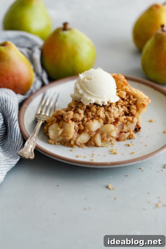 Golden Pear Crumble Delight 2 Slice of Pear Pie with Streusel Topping, showing the flaky crust, juicy filling, and golden streusel
