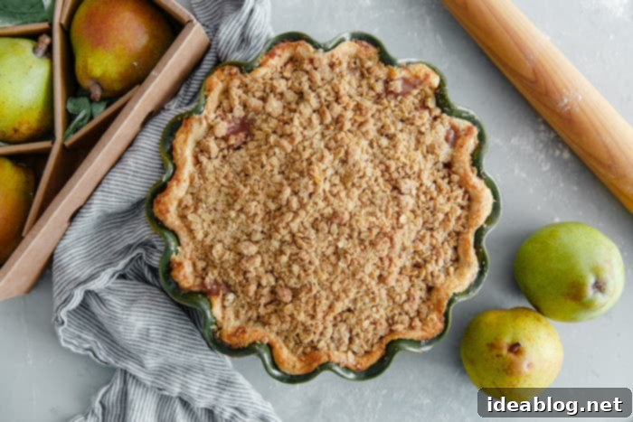 Golden Pear Crumble Delight 3 Baked Pear Pie with Golden Streusel Topping cooling on a rack
