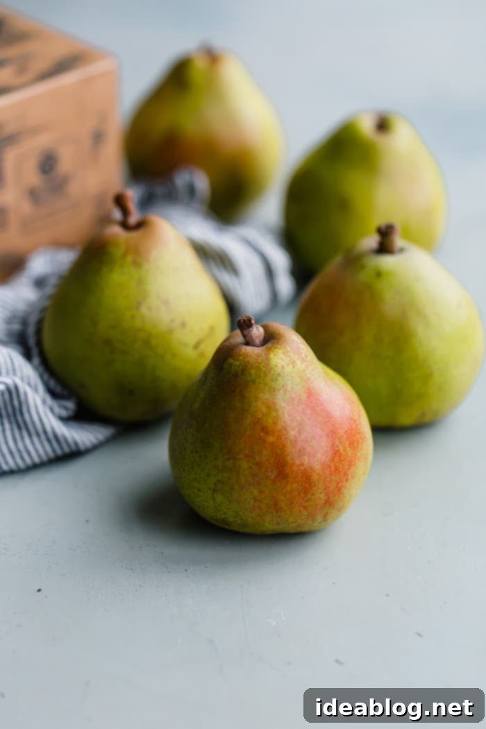 Golden Pear Crumble Delight 4 Fresh Comice pears, ideal for baking, displayed beautifully