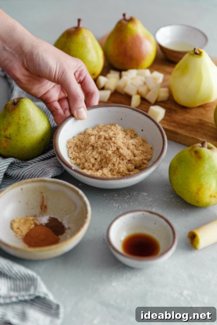 Golden Pear Crumble Delight 7 Ingredients for pear pie filling laid out on a counter