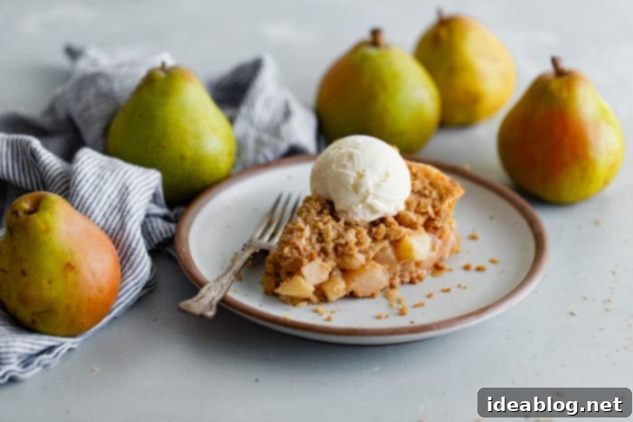 Golden Pear Crumble Delight 10 A perfect slice of pear pie, showcasing the layers of crust, filling, and streusel
