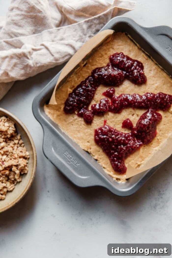Rustic Raspberry Hazelnut Crumb Bake 13 Dolloping St. Dalfour Red Raspberry Fruit Spread over the smoothed cake batter.