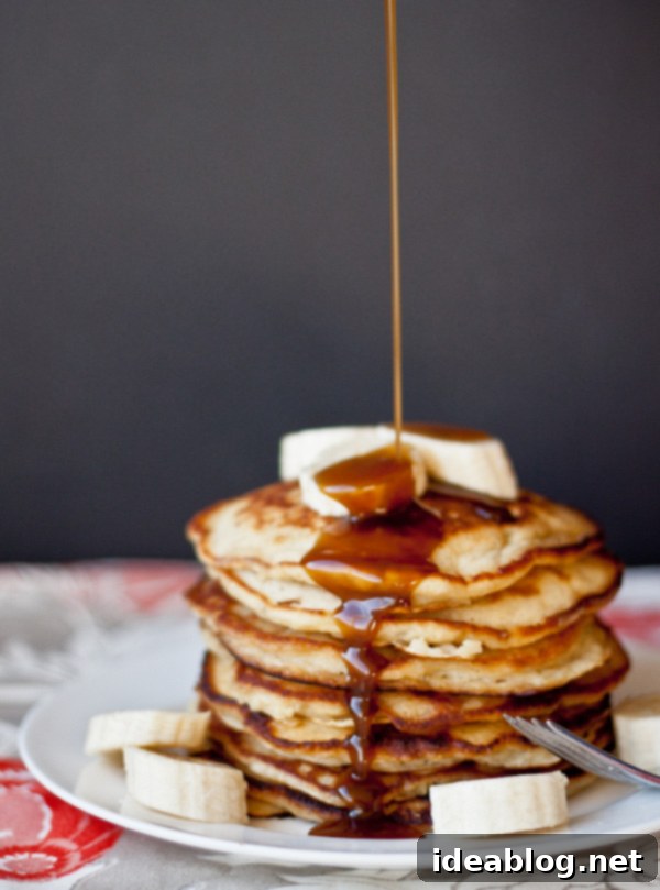 Tropical Banana Pancakes with Golden Coconut Caramel 5 Golden banana pancakes topped with a generous pour of coconut caramel syrup