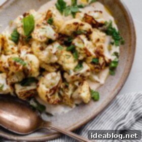 Golden Roasted Cauliflower with Zesty Tahini Mint Drizzle 4 Roasted Cauliflower with Tahini and Mint plated with a side
