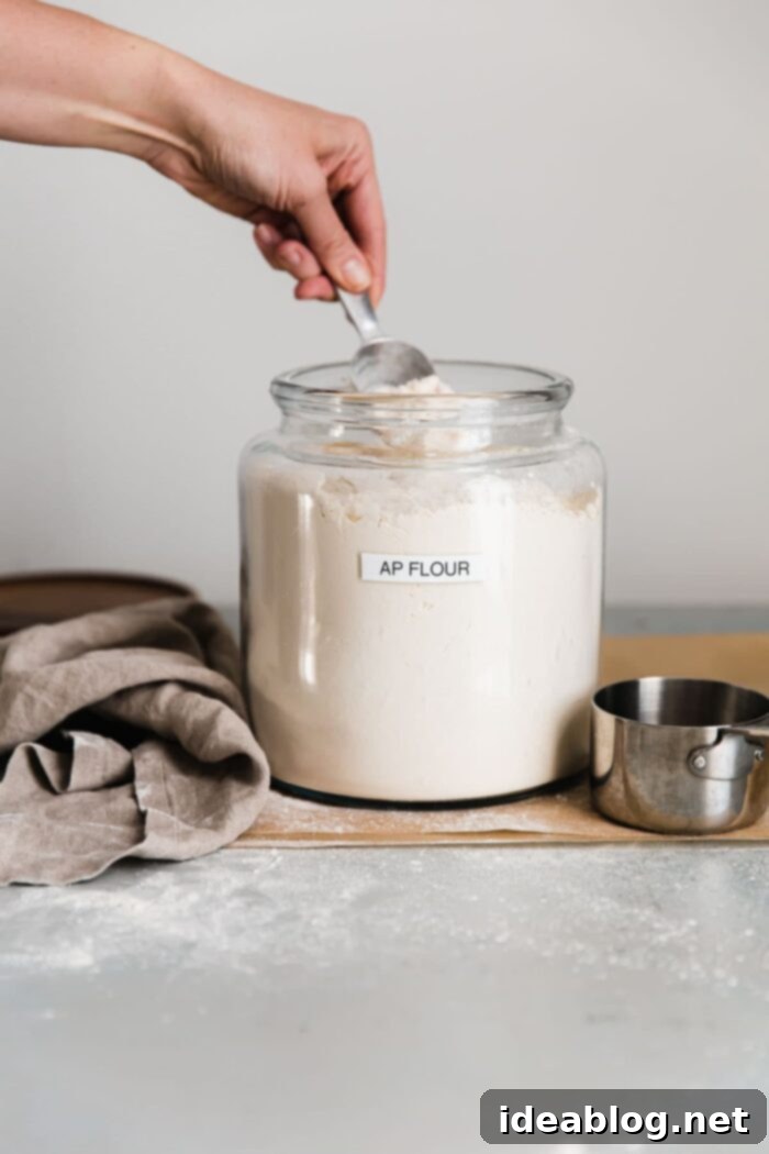 Mastering Flour Choices Bread vs All Purpose 8 Scooping Flour from Container