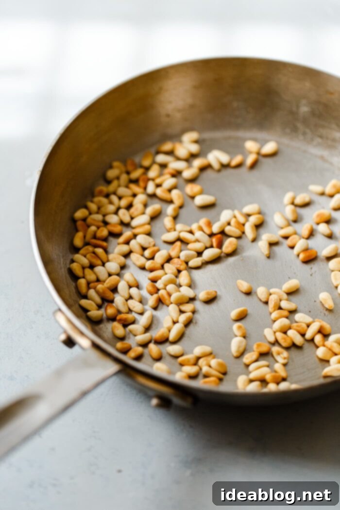 How to Perfectly Toast Pine Nuts 8 Perfectly Dry Toasted Pine Nuts Cooling in a Skillet
