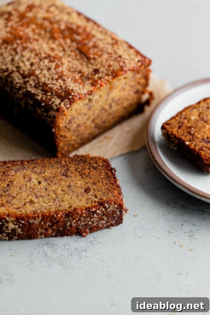 Ultimate Moist Banana Bread 4 Close-up of a perfectly sliced, super moist banana bread showing its tender crumb and sugary top