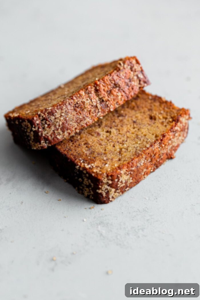 Ultimate Moist Banana Bread 5 A slice of moist banana bread resting on its side, highlighting the delicious texture and sugar topping