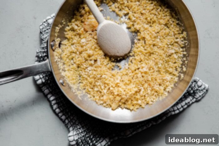 Irresistible Garlic Crunch 6 Panko bread crumbs toasting in a skillet until golden