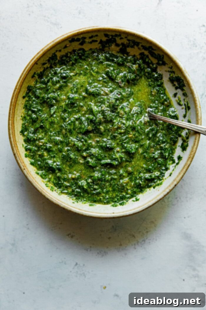 Vibrant Green Salsa Verde 2 Vibrant Green Herb Salsa Verde served generously with grilled food