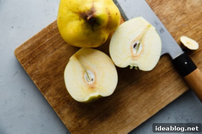 Silken Poached Quince 4 Sliced quince on a cutting board, ready for poaching
