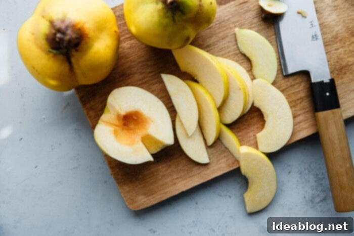 Silken Poached Quince 7 Thinly sliced quince pieces on a cutting board