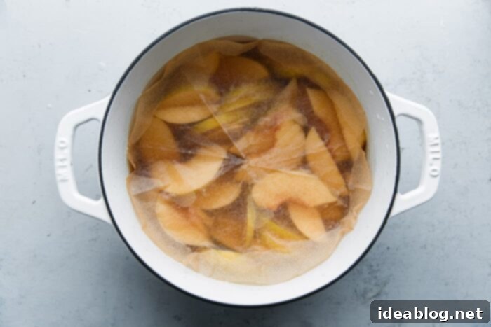 Silken Poached Quince 8 Poaching fruit covered with a parchment cartouche