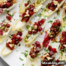 Zesty Beet and Goat Cheese Endive Boats 10 Beet and Goat Cheese Endive Bites - recipe image