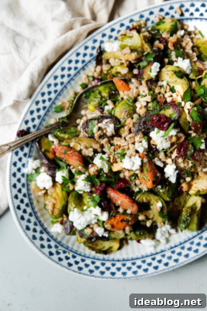 Autumn Harvest Farro Bowl 13 Fall Farro Salad artfully arranged on a rustic wooden platter, ready for a gathering