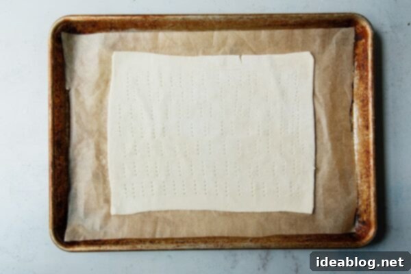 Autumn Apple Cloud Tart 17 Docked Puff Pastry Dough on Sheet Pan