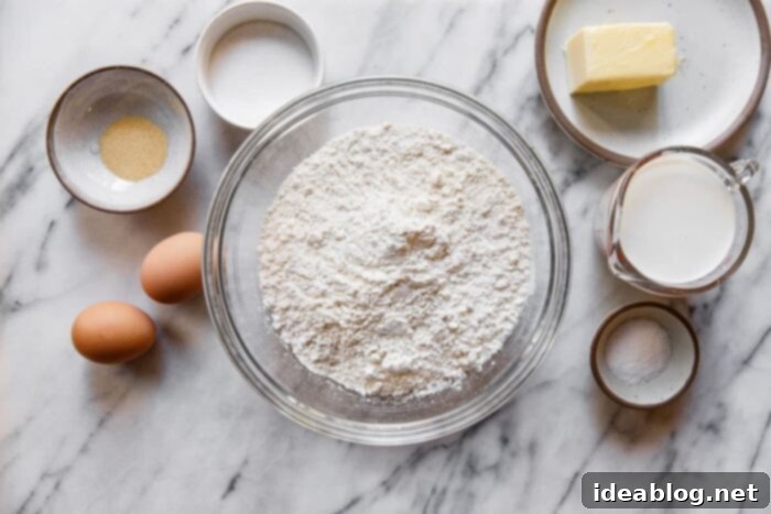 Cake Flour Versus All Purpose Flour Understanding the Differences 4 Various baking ingredients including flour, eggs, and sugar on a wooden table