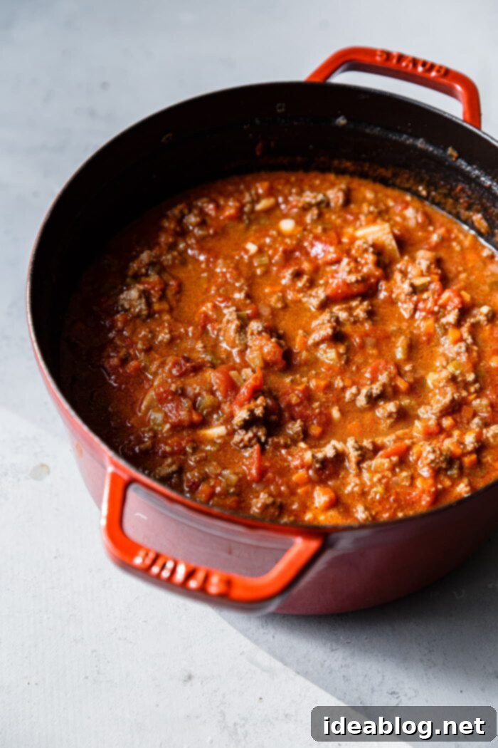 Marcella Hazan's Signature Bolognese 3 Ingredients for Marcella Hazan Bolognese Sauce laid out on a table.