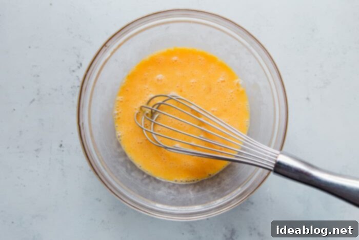 Fluffy Cheesy Eggs with Fresh Greens 6 Bowl of whisked eggs ready for cooking