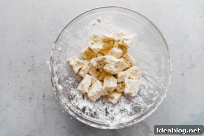 Spicy Peanut Crunch Tofu 8 Tofu Tossed with Cornstarch in Bowl