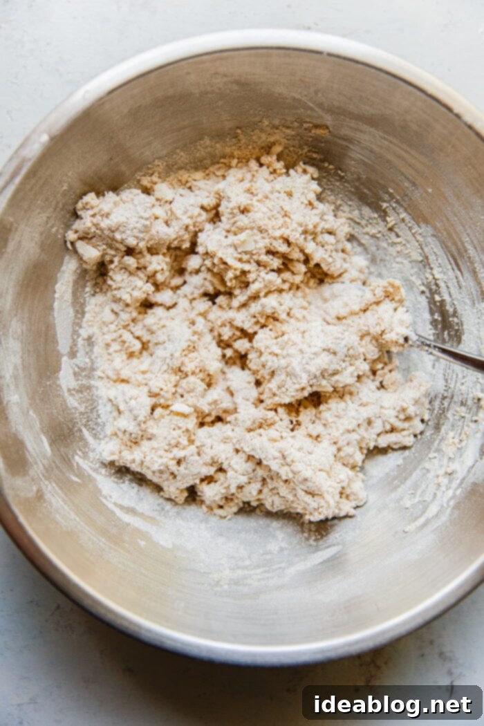 Zesty Orange Glazed Rhubarb Scones 5 Scone dough mixture with butter in a large bowl, prior to adding liquid.