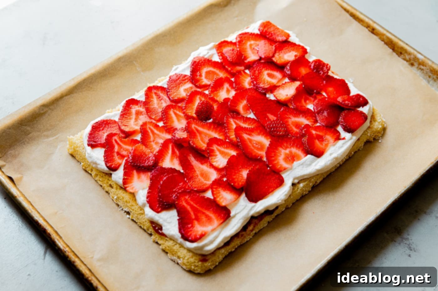Festive Flag Dessert 11 Decorating an American Flag Cake with blueberries and raspberries