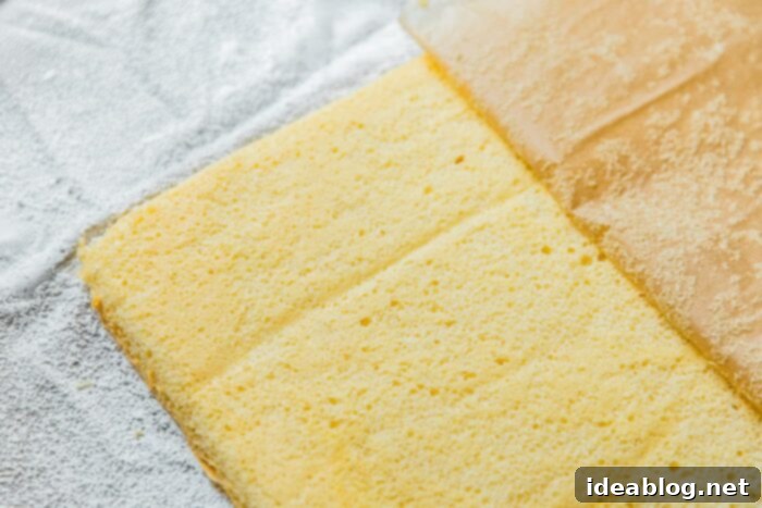Festive Flag Dessert 7 Spreading sponge cake batter evenly on a baking sheet