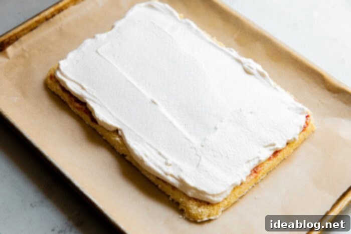 Festive Flag Dessert 10 Final layer of whipped cream on flag cake before berry decoration