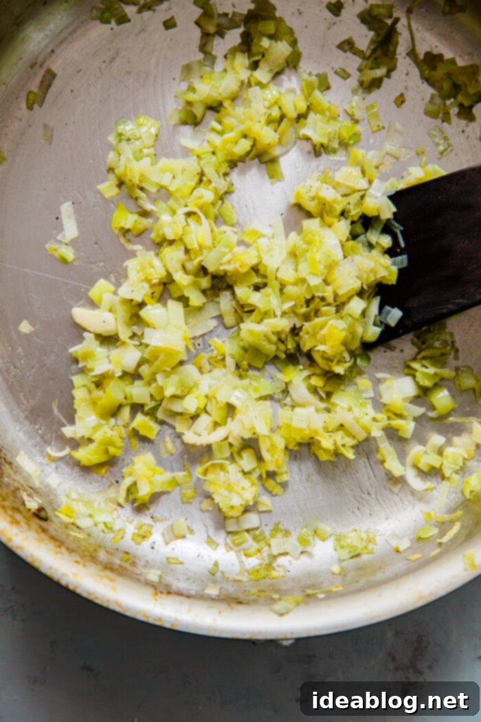 Artisan Gruyère Leek Quiche 3 Sautéed Leeks in a Skillet - Prepping for Quiche