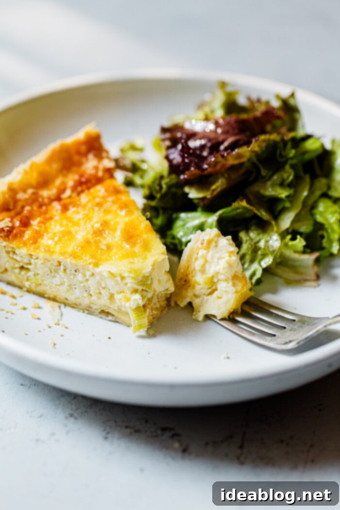 Artisan Gruyère Leek Quiche 8 Whole Gruyere Leek Quiche on a Cutting Board