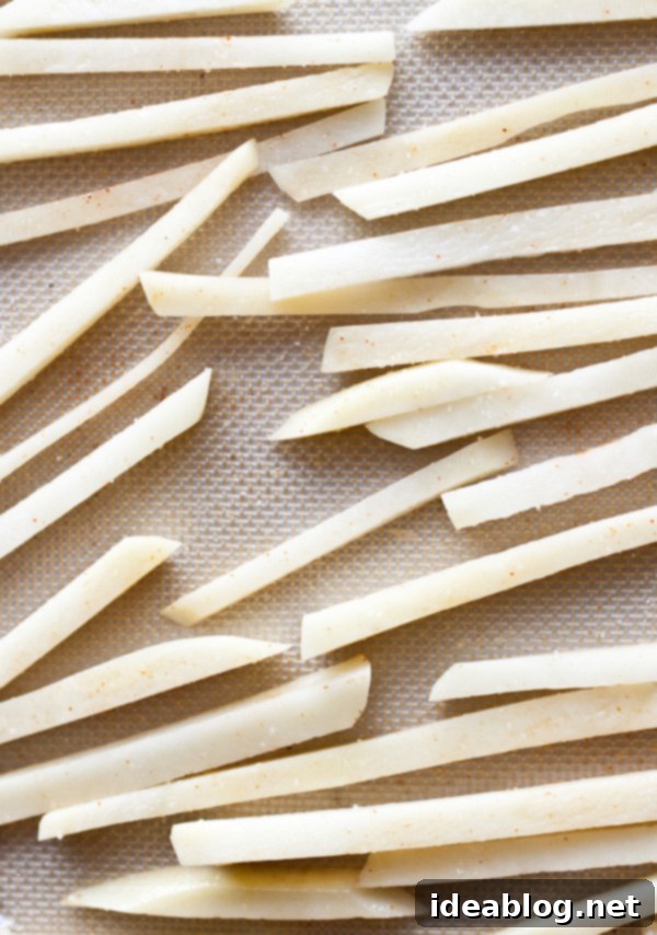Oven-Baked Spicy Fries with Refreshing Raita 5 Potato Matchsticks on Baking Sheet