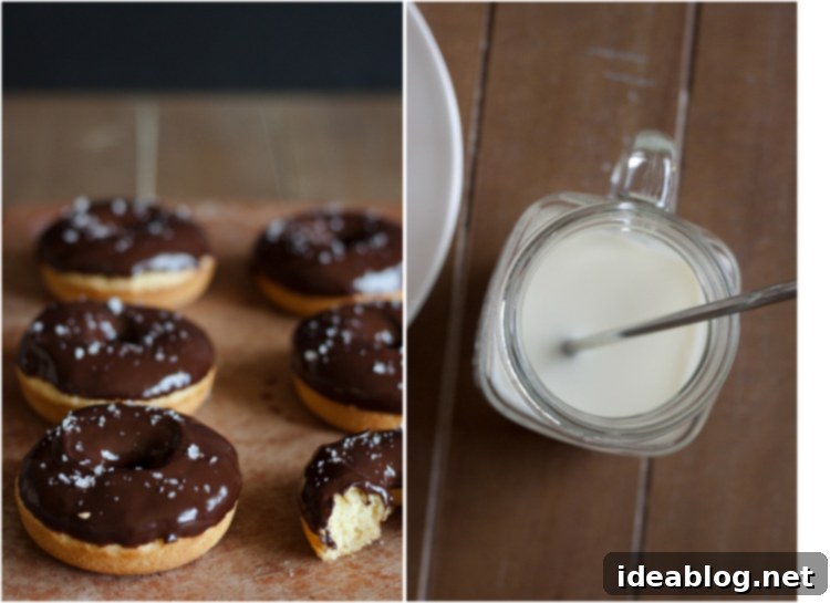 Moist Olive Oil Baked Doughnuts with Rich Dark Chocolate Glaze 5 A closer look at a finished Baked Olive Oil Doughnut, showcasing the smooth dark chocolate glaze and crunchy flaky salt texture.
