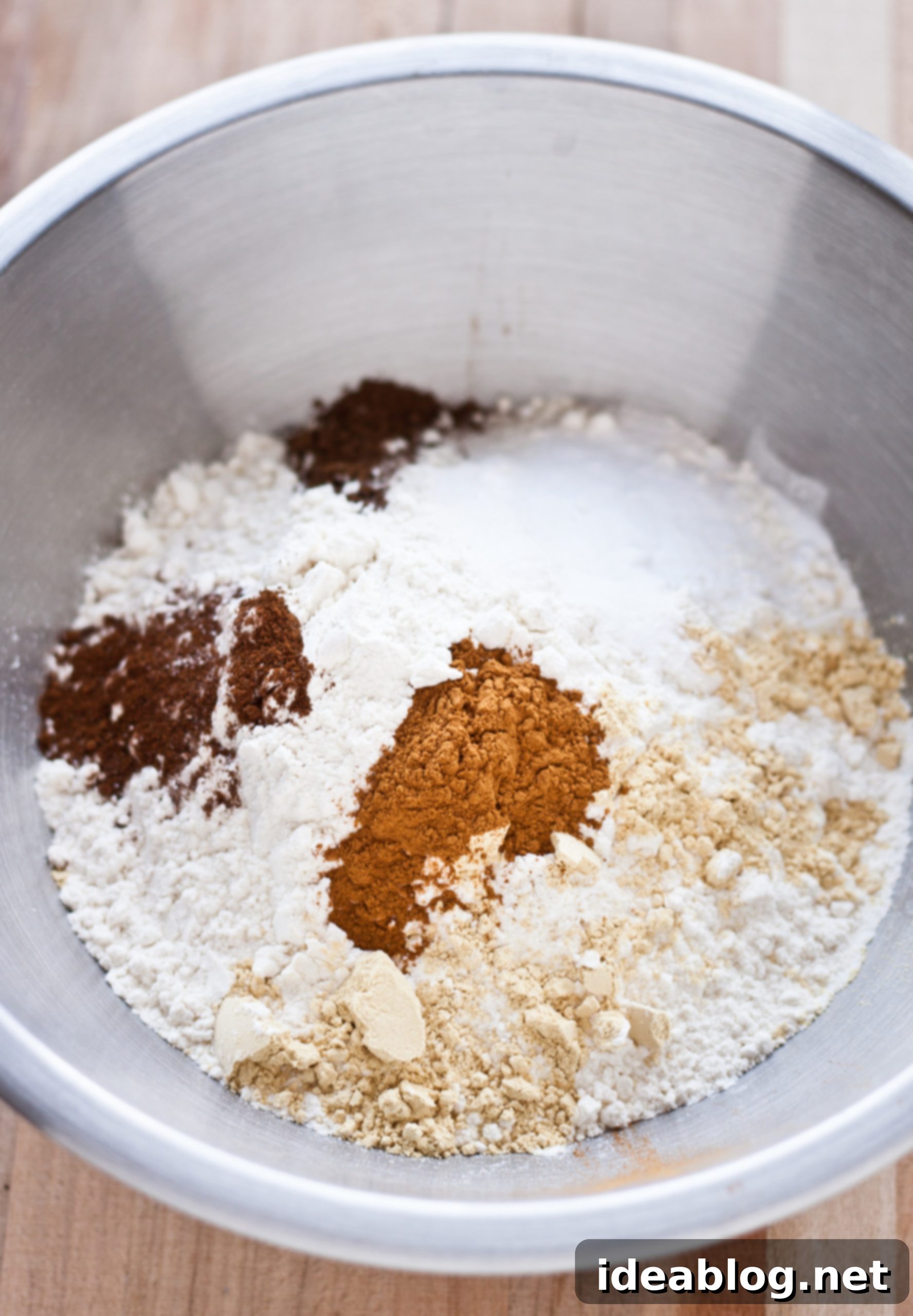 Pomegranate-Kissed Gingerbread Clouds 3 Close-up of dry ingredients for gingerbread cupcakes, including flour and warming spices