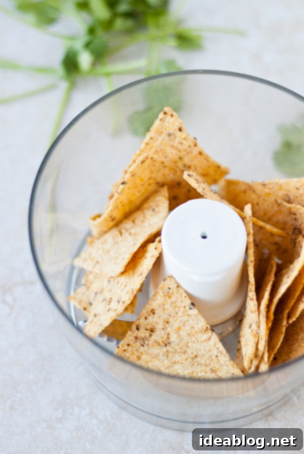 Crispy Tortilla Chicken Salad with Fresh Cilantro Dressing 4 Tortilla Chips Being Ground in a Food Processor