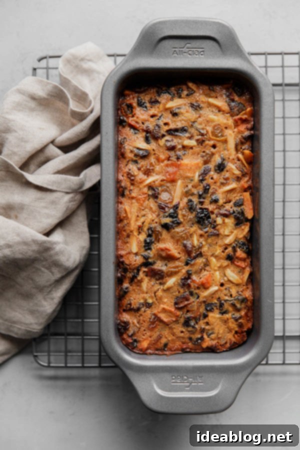 Global Grand Champion Fruit Cake 3 Christmas Fruit Cake in Loaf Pan on Baking Rack