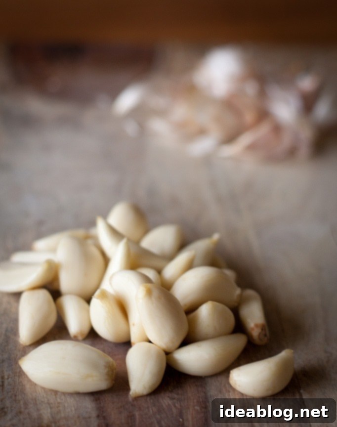 How to Peel An Entire Head of Garlic in Seconds {Life-Changing Video Included!} Peeled Garlic Cloves