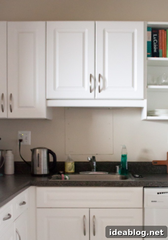 Our Kitchen Unveiled 8 An open pantry cabinet, well-stocked with food items
