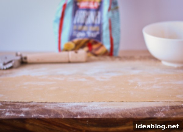 Mastering Homemade Agnolotti 4 Step-by-step image showing how to make homemade agnolotti pasta, with dough being prepared.