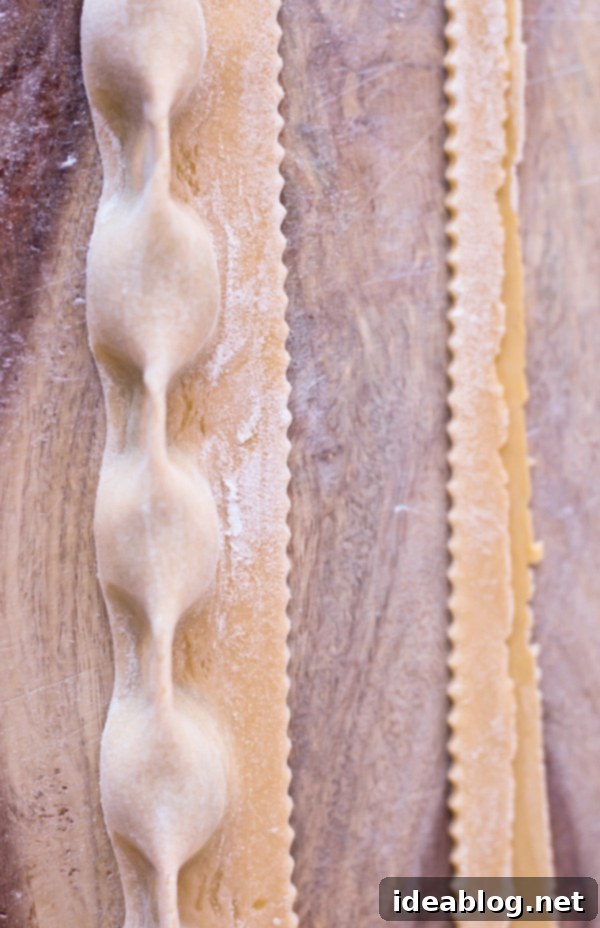 Mastering Homemade Agnolotti 7 A tray of freshly made Homemade Agnolotti Pasta, dusted with semolina flour.