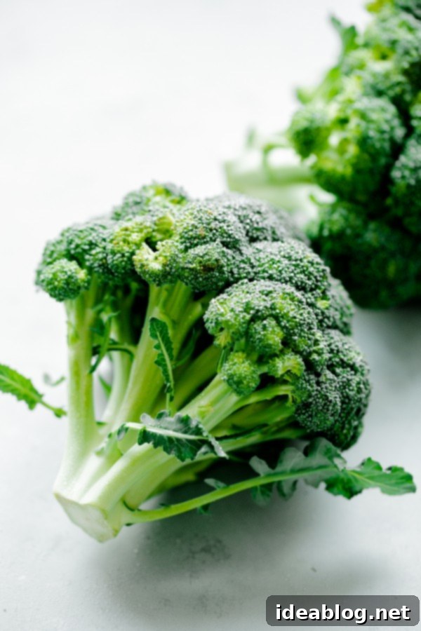 Effortlessly Delicious Roasted Broccoli 3 Perfectly Roasted Broccoli with a delightful mix of toasted almonds, fresh lemon, a touch of red pepper flakes, and rich pecorino cheese.